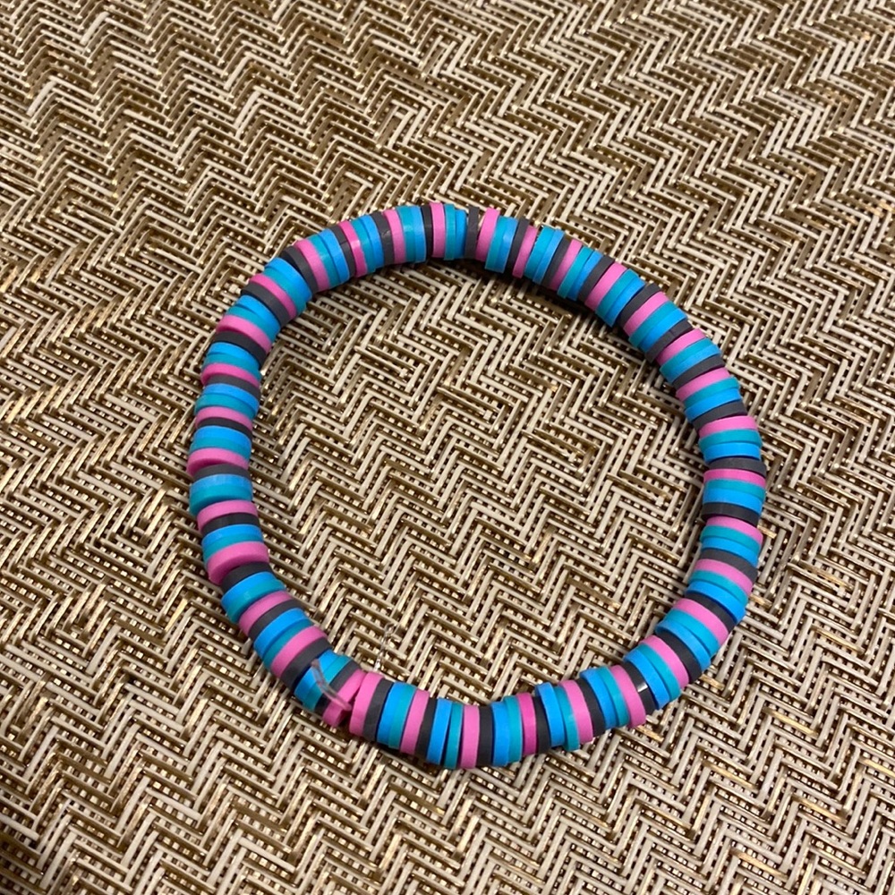 pink,gray,light blue, and turquoise bracelet